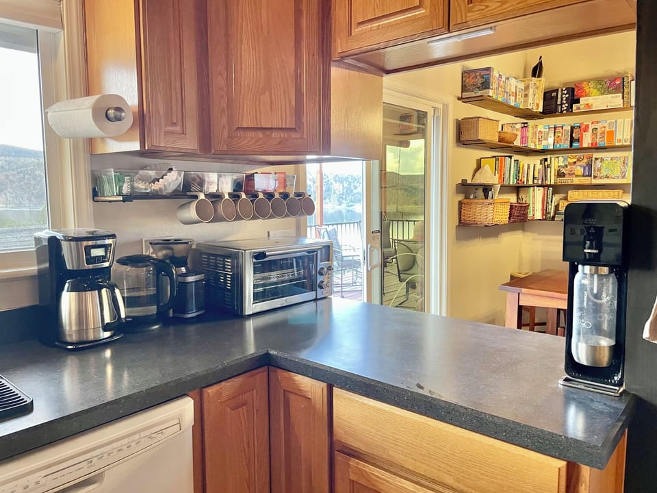 Coffee bar with teas, a Sodastream, and a toaster oven/air fryer