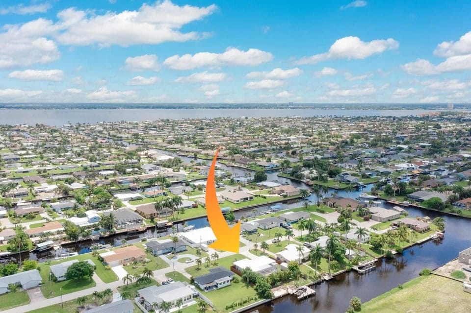 A breathtaking aerial view showcasing the home’s prime location and stunning canal scenery.
