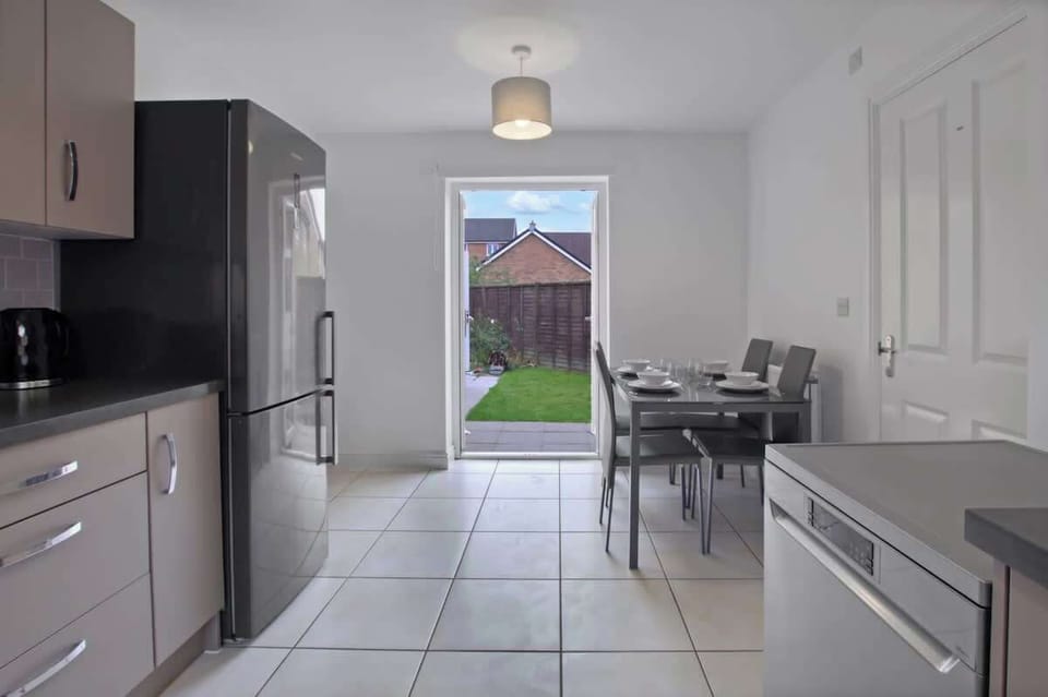 Dining Area: Comfortable dining space with seating for guests and direct access to the garden.