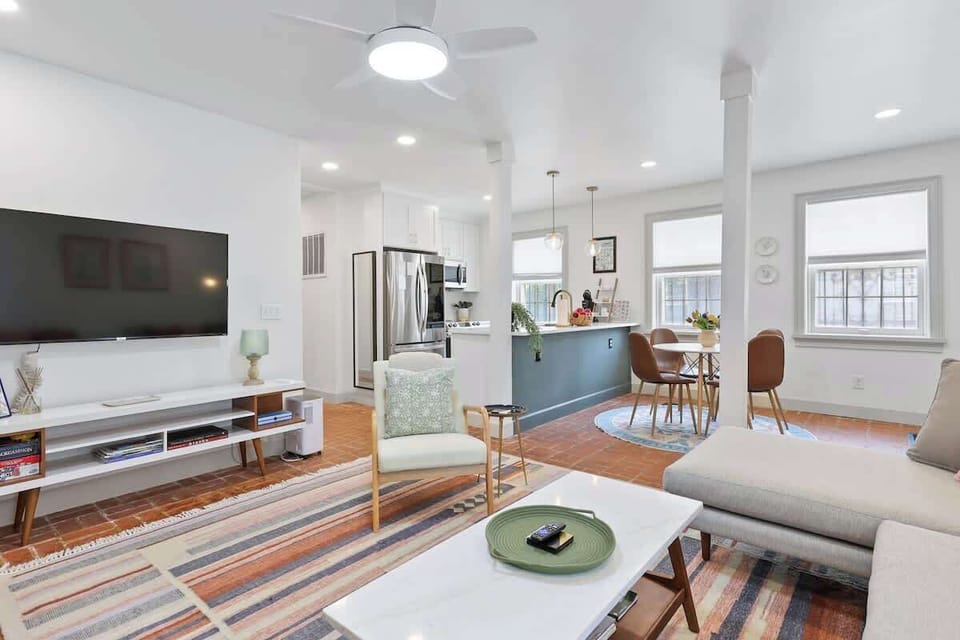 The spacious living room offers a comfortable place to relax, connect, and unwind after a day of exploring