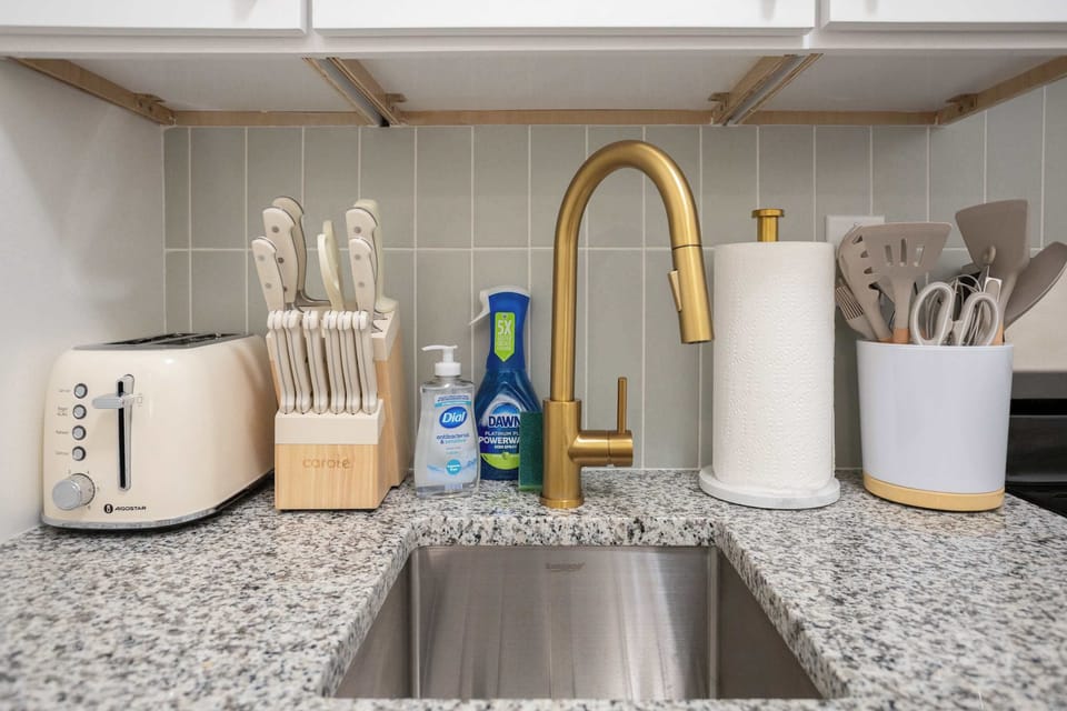 Bright, spacious, and thoughtfully stocked, the kitchen provides a welcoming space to gather and cook together