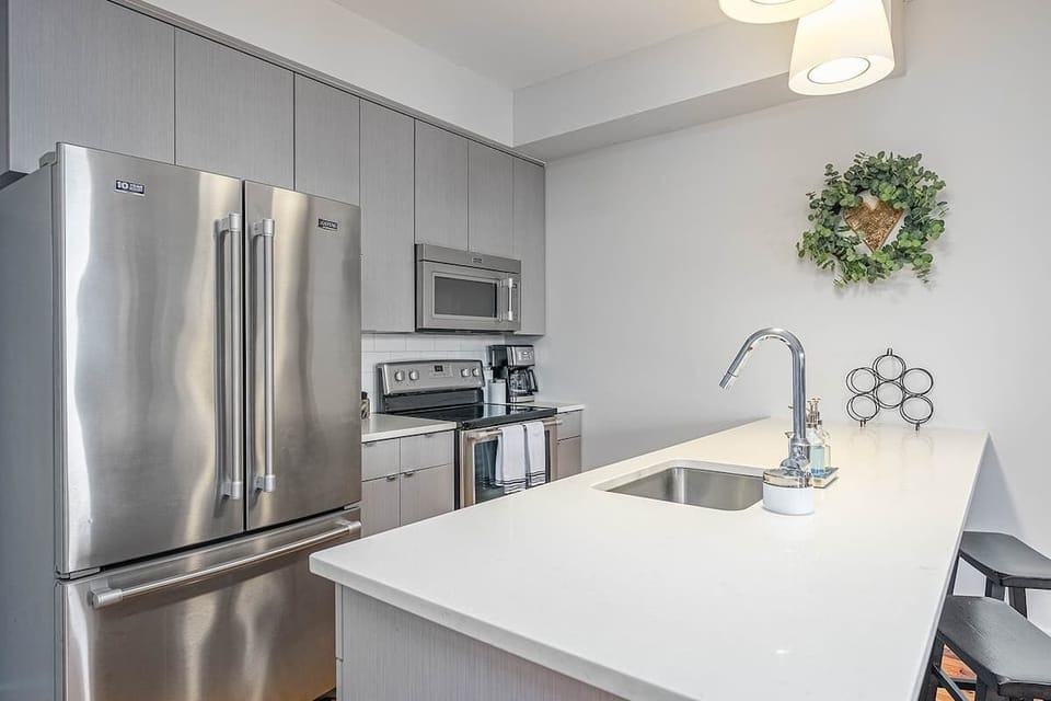 A bright kitchen with spacious countertops that make cooking feel simple and enjoyable.
