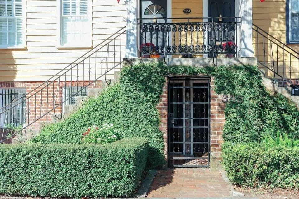 Quintessential Savannah garden entrance! You will be staying on the lower level on the left.