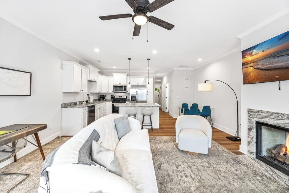 A seamless blend of living, dining, and kitchen areas makes this space ideal for entertaining and connecting.