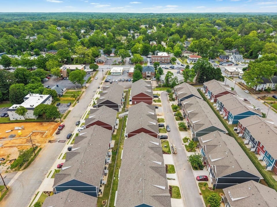 A peek at the neatly aligned, modern townhomes that make this community feel private and secure.