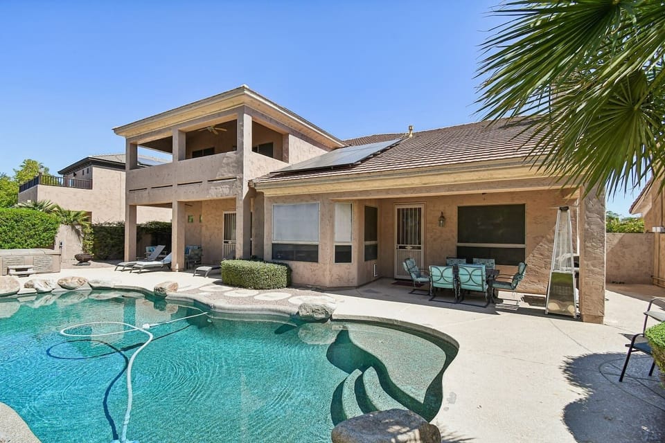 Sparkling pool, covered patio, and outdoor seating — your Scottsdale retreat