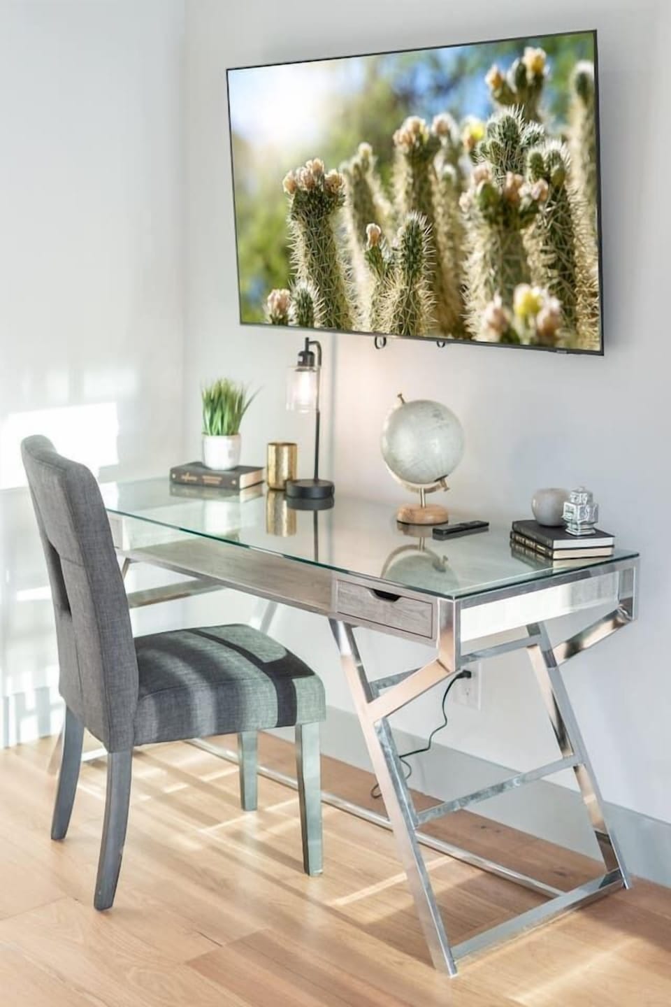 Dedicated workspace with a mirrored desk and smart TV—perfect for staying connected while away.