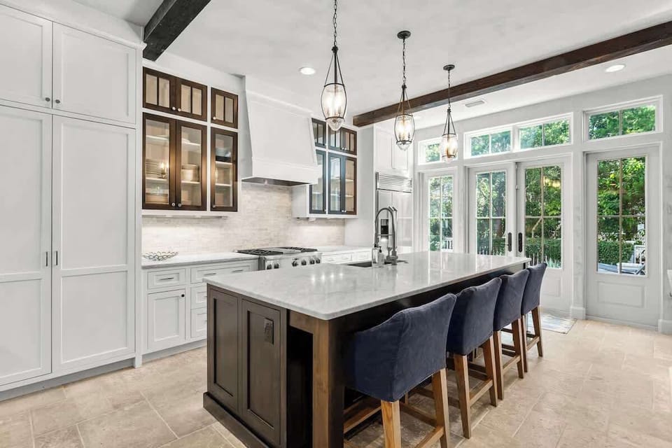Fully stocked kitchen with island seating for 4. Perfect for preparing family meals!