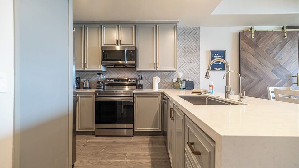 The kitchen reflects the fully remodeled feel of the condo