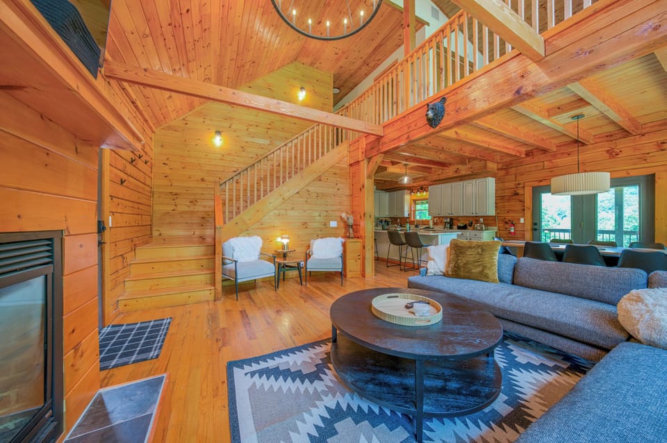 Spacious living room with gas log fireplace, 32" TV for streaming, and sectional seating