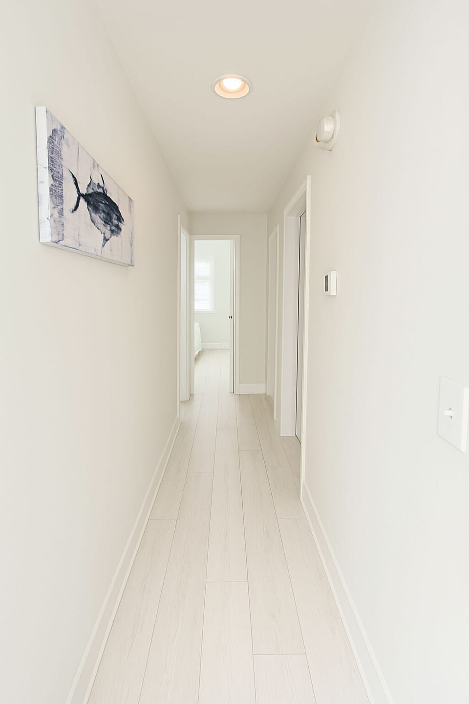 Hallway to the rooms and bathrooms