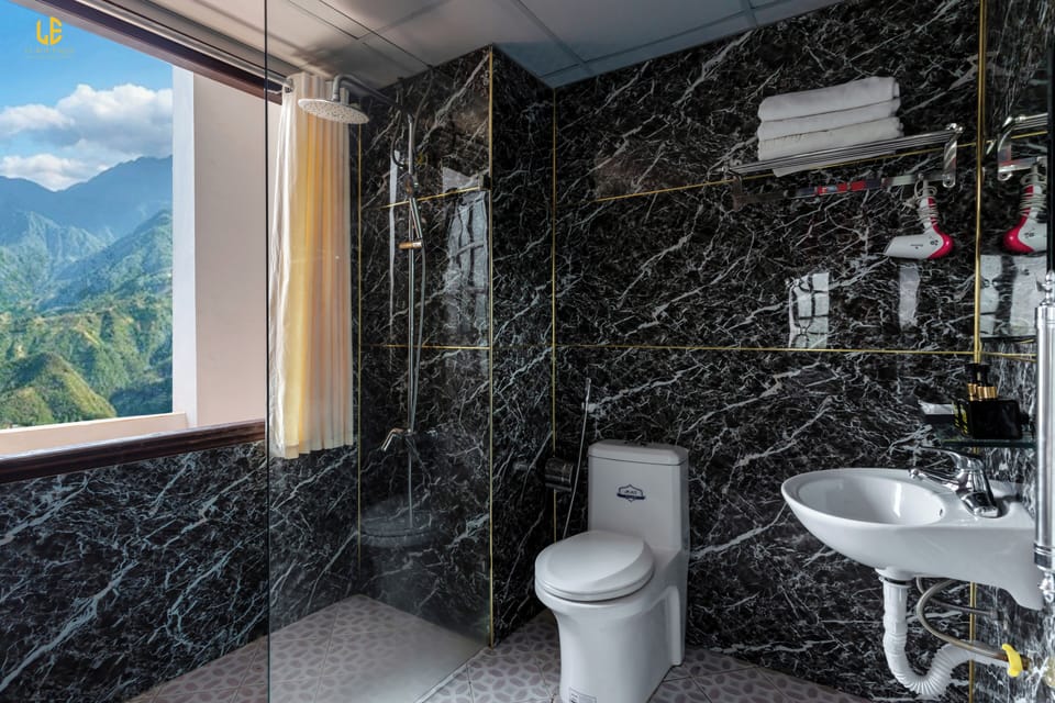 Deluxe Triple Room | Bathroom | Shower, slippers, towels, soap