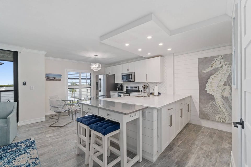 The open, updated kitchen is fully stocked and ready for any cooking or cocktailing endeavor.