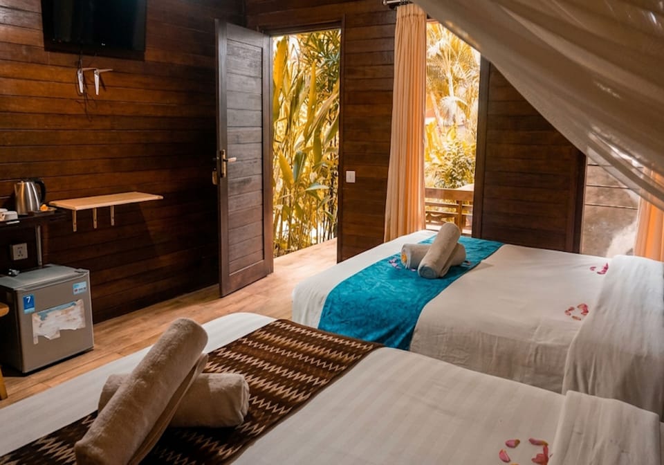 Family Room, 2 Queen Beds | In-room safe, desk, laptop workspace, bed sheets
