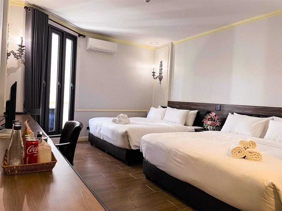 Quadruple Room, City View | Free minibar, blackout drapes, soundproofing, free WiFi
