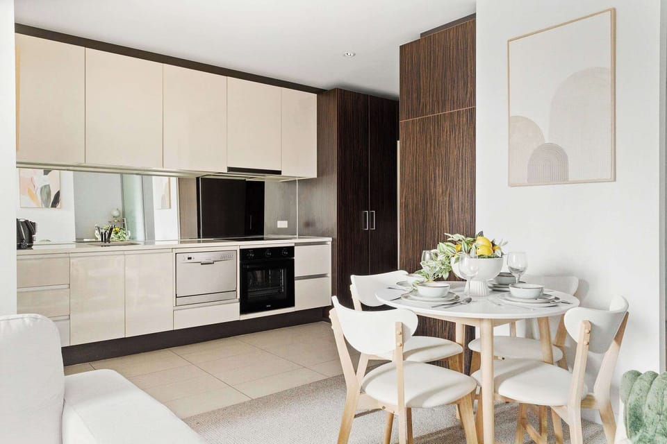 A fully decked kitchen & dining area.