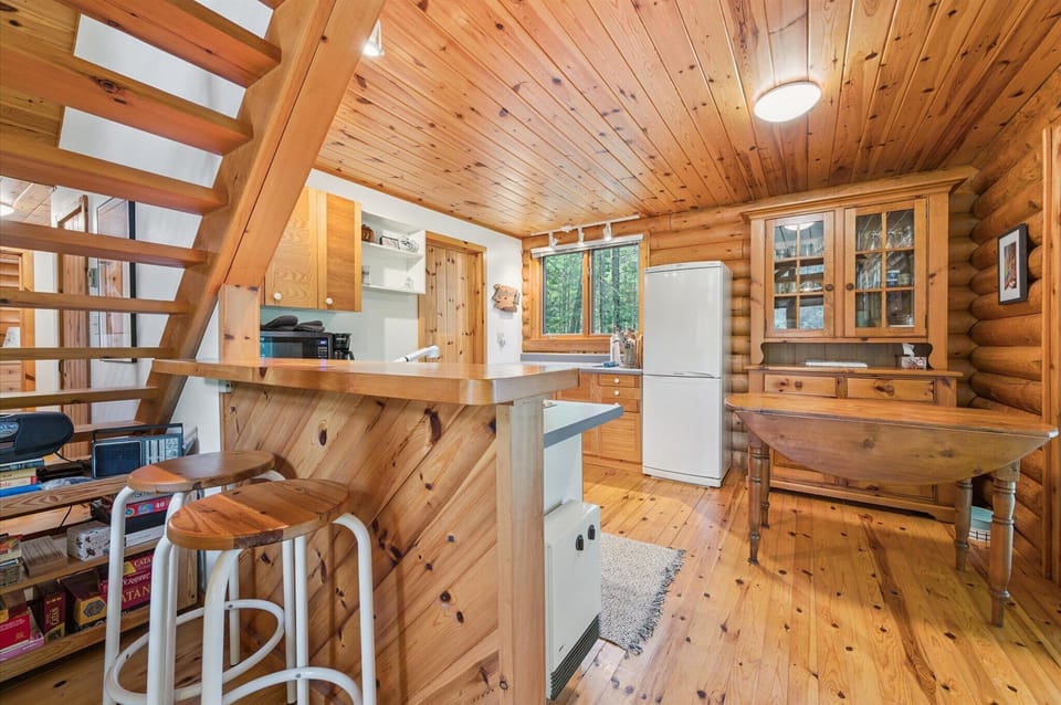 A fully equipped kitchen with all the essentials, blending rustic log-cabin character with modern comfort for easy, relaxed meals.