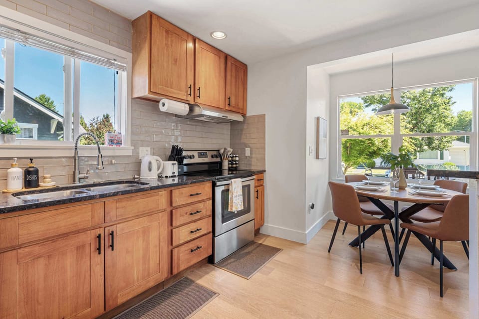 Where efficiency meets style: dual sinks, organized prep space, and a dining nook for casual meals.