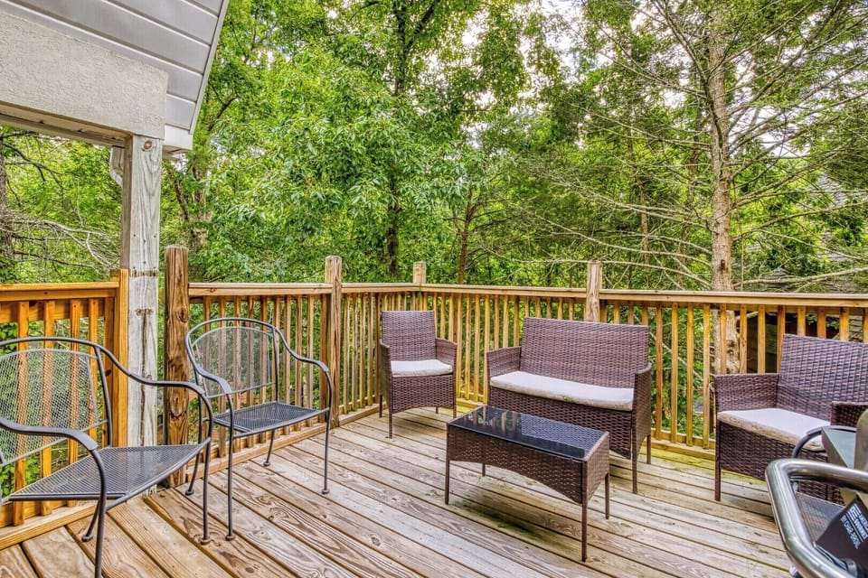 Vacation Rental in the Smoky Mountains with a Hot Tub "Feathers and Fur" - Main level deck with sitting area