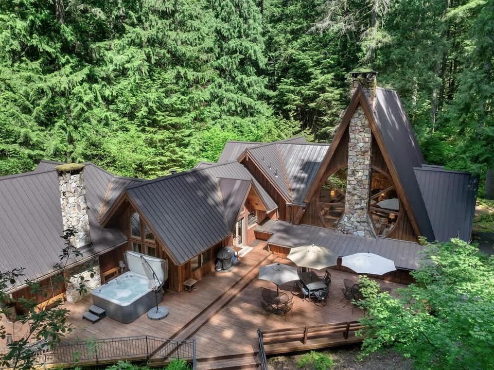 The cabin is complete with a hot tub and spacious deck.