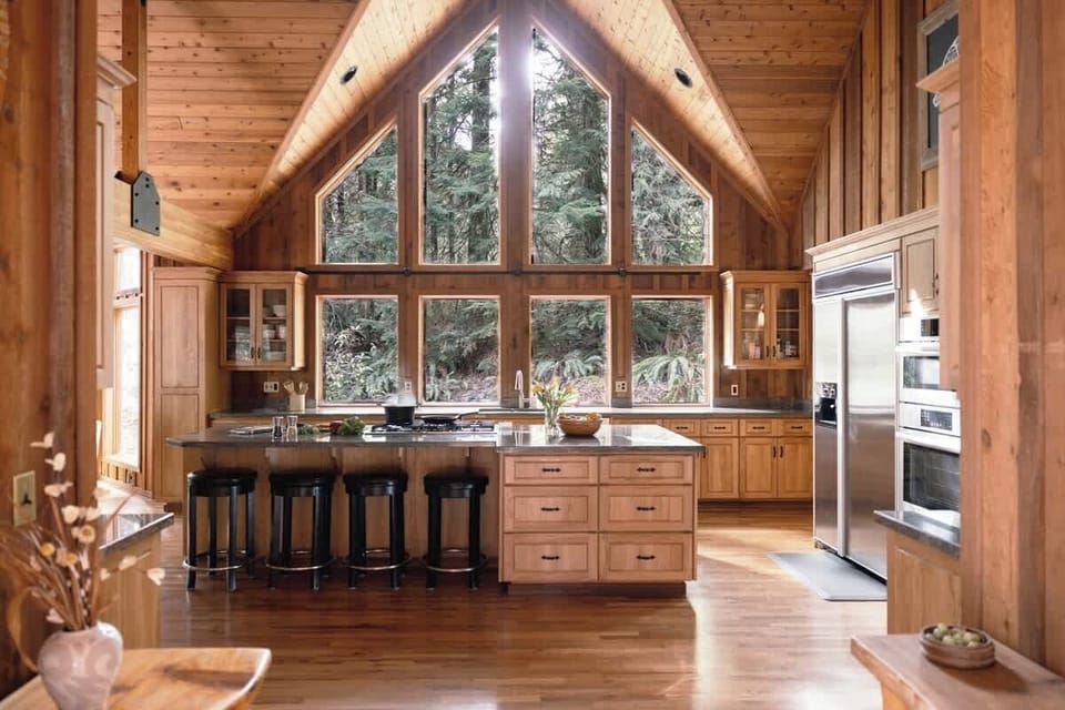 
Cook with a view! This stunning kitchen, surrounded by nature, offers an elevated culinary experience. Your cozy forest retreat awaits with Cascadia Getaways!