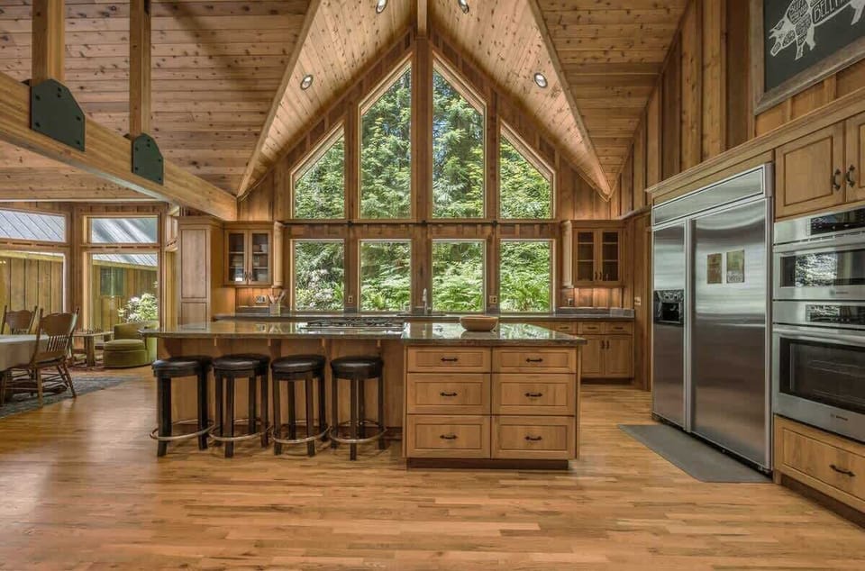 
Whip up gourmet meals with a view! This spacious, fully-equipped kitchen and dining area is perfect for memorable gatherings. Experience culinary bliss with Cascadia Getaways!