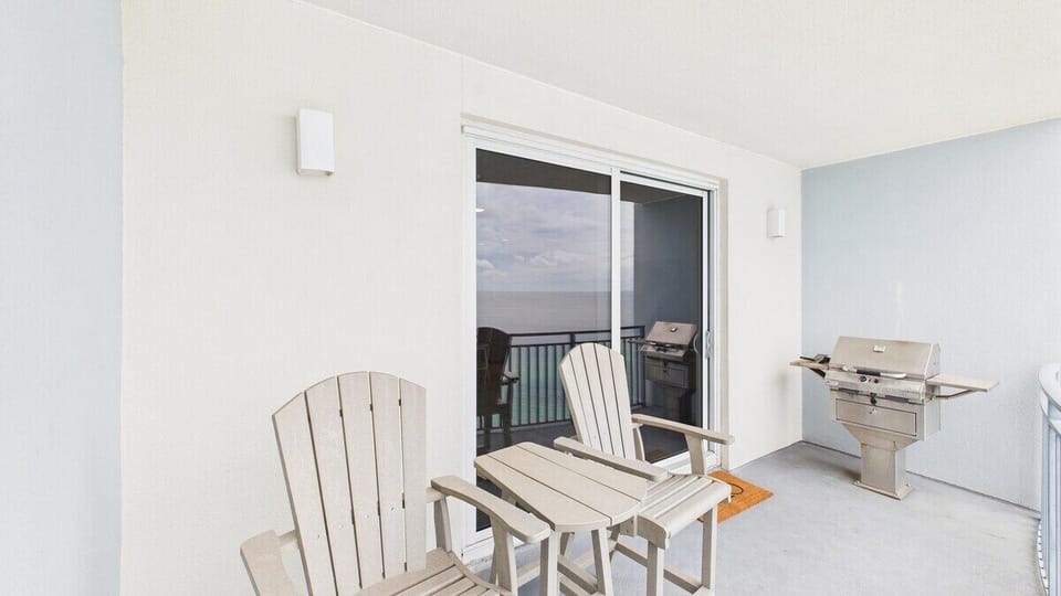 Spacious balcony with furnishings and grill