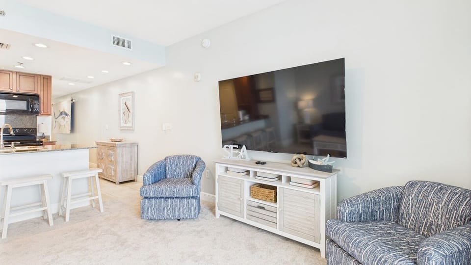 Open concept living area with stylish furnishings
