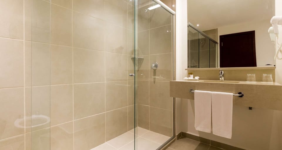 Shower, eco-friendly toiletries, hair dryer, towels