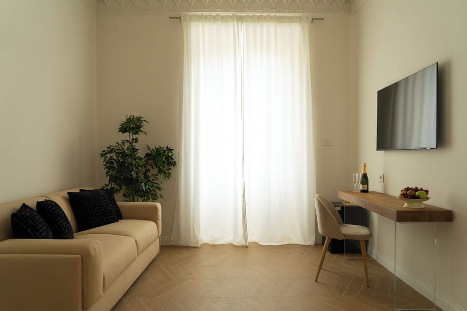 Luxury Studio Suite, Balcony, City View | In-room safe, desk, laptop workspace, soundproofing