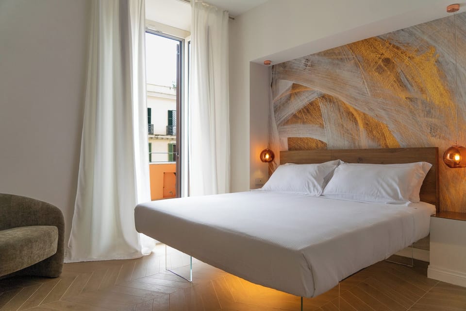 Luxury Studio Suite, Balcony, City View | In-room safe, desk, laptop workspace, soundproofing