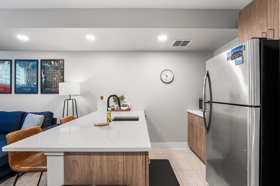 Well equipped kitchenette with full size fridge, toaster oven, and plenty of counter space for meal prep.