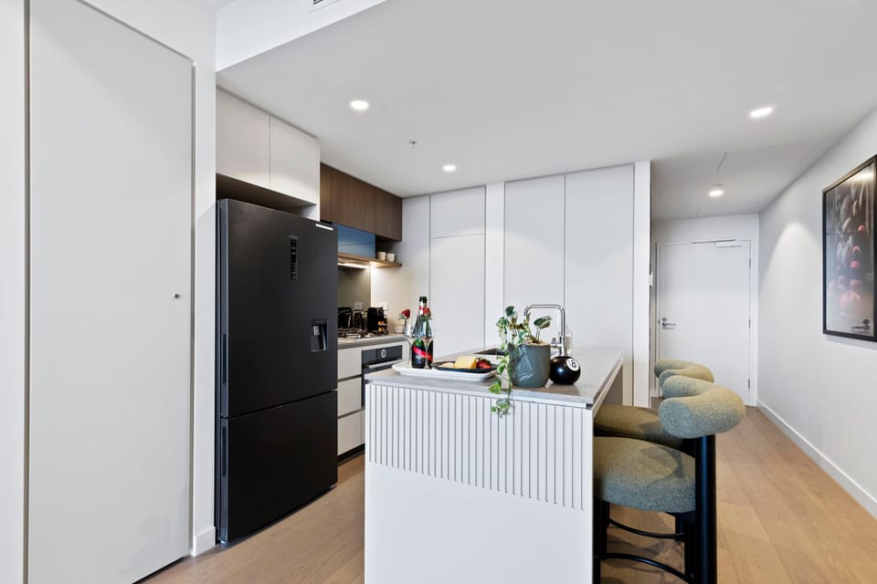 Fully equipped kitchen with premium appliances, ample storage, and Nespresso.