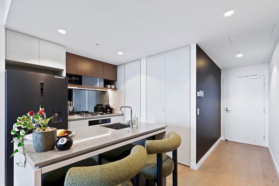 Fully equipped kitchen with premium appliances, ample storage, and Nespresso.