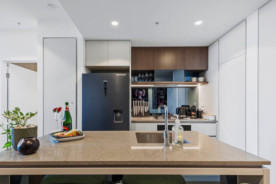 Fully equipped kitchen with premium appliances, ample storage, and Nespresso.