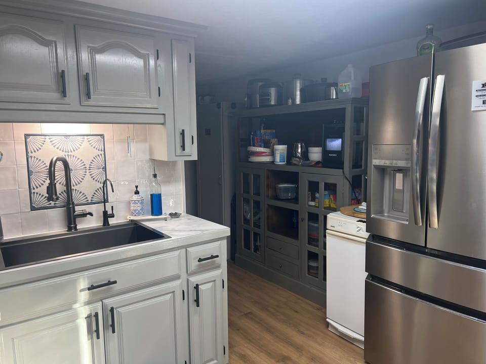 Kitchen with trash compactor