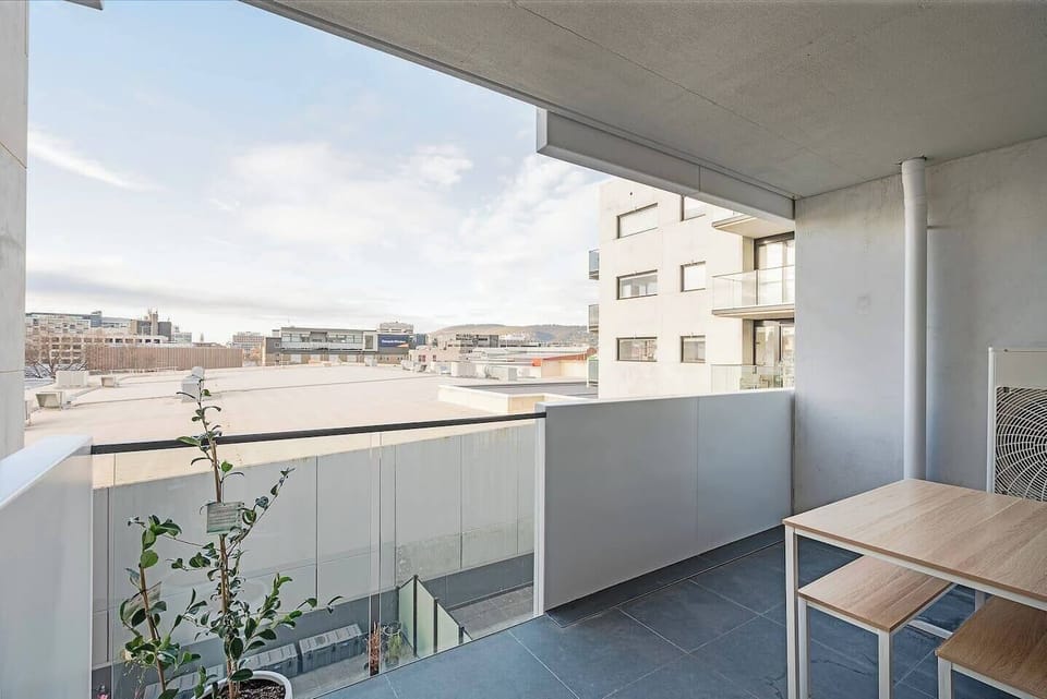 Take in peaceful rooftop views from the private balcony — an ideal spot for alfresco breakfasts or a glass of wine at sunset.
