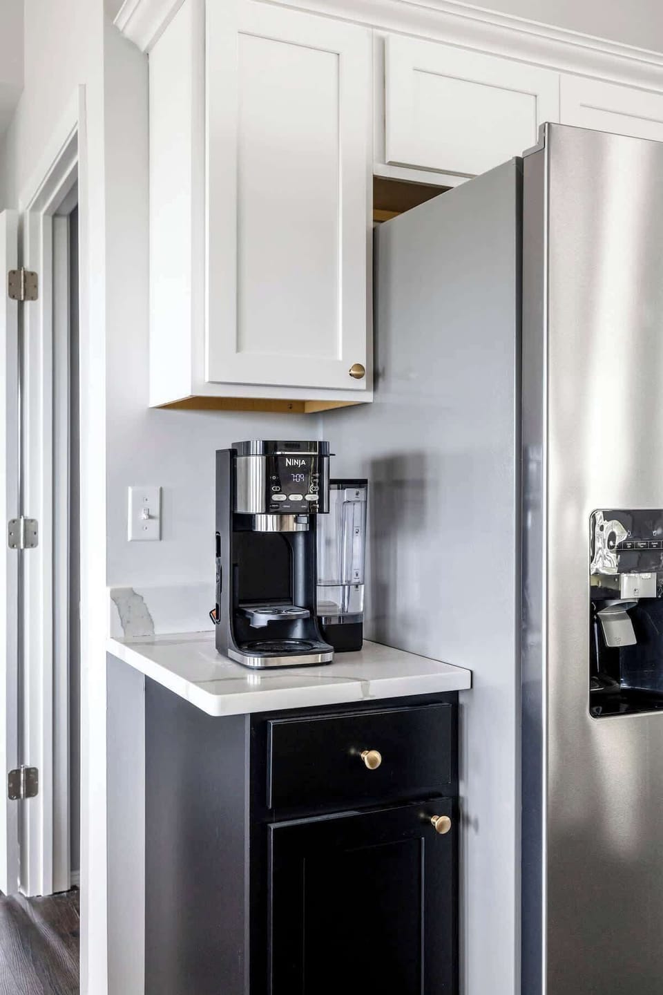 Coffee bar with Ninja brewer beside the French-door fridge