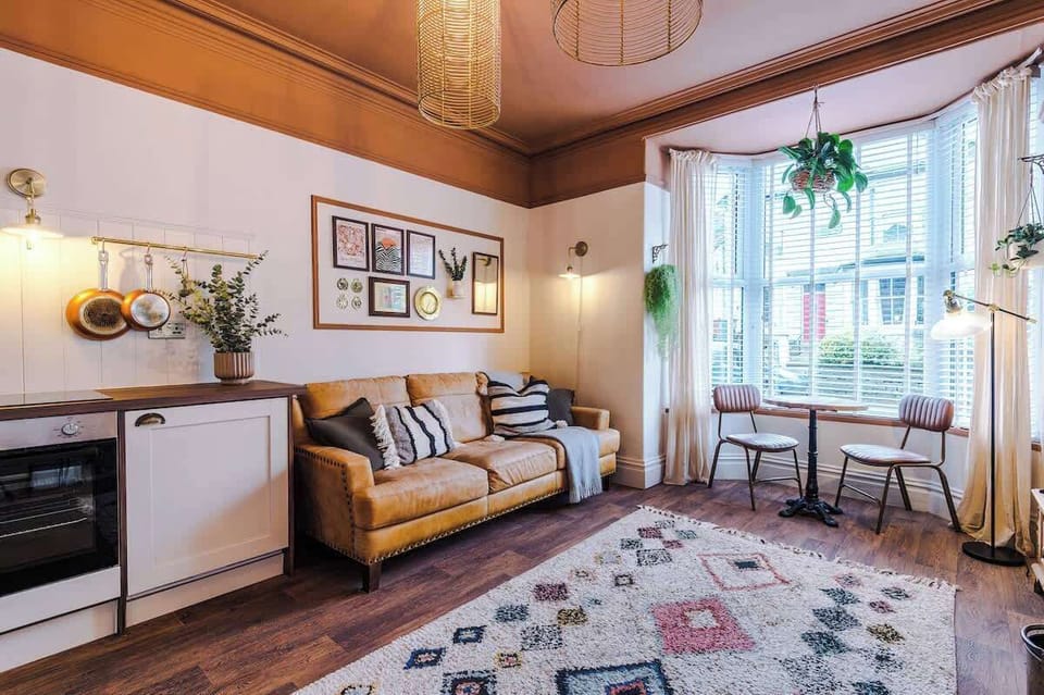A beautiful, grand fireplace at the heart of the living space.