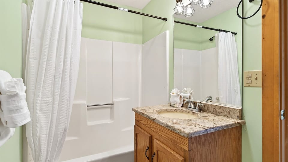 Ensuite bathroom attached to the king bedroom with tub and shower combo