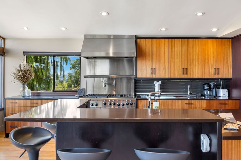 Fully equipped kitchen with stainless steel appliances—ready for your culinary creations.