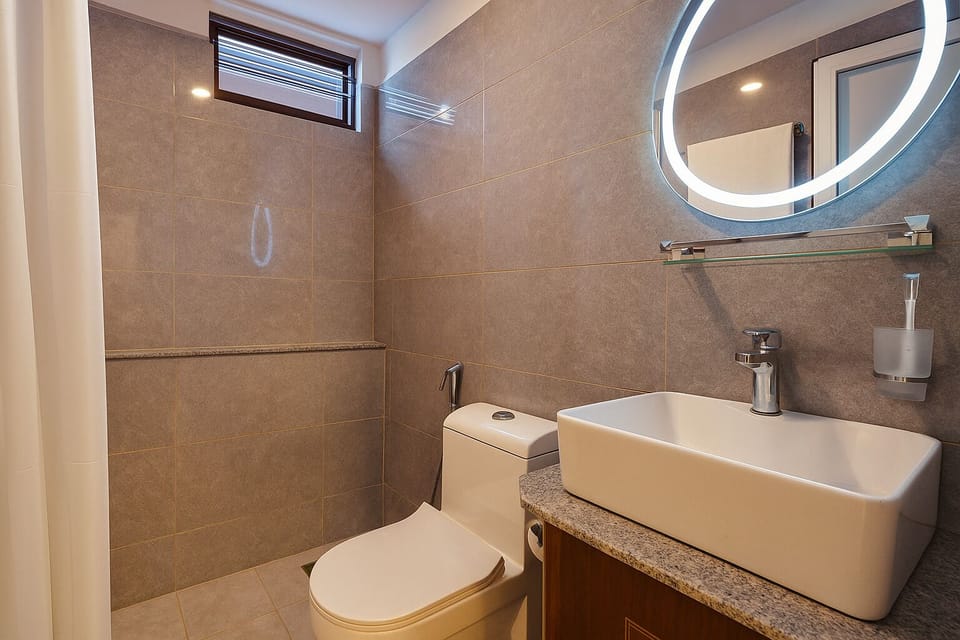 Shower, hair dryer, slippers, towels
