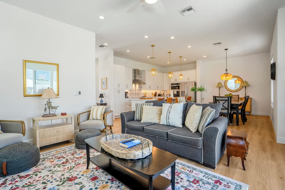Comfortable living room area of the Pink Pearl with a cozy couch and chairs—perfect for relaxing.