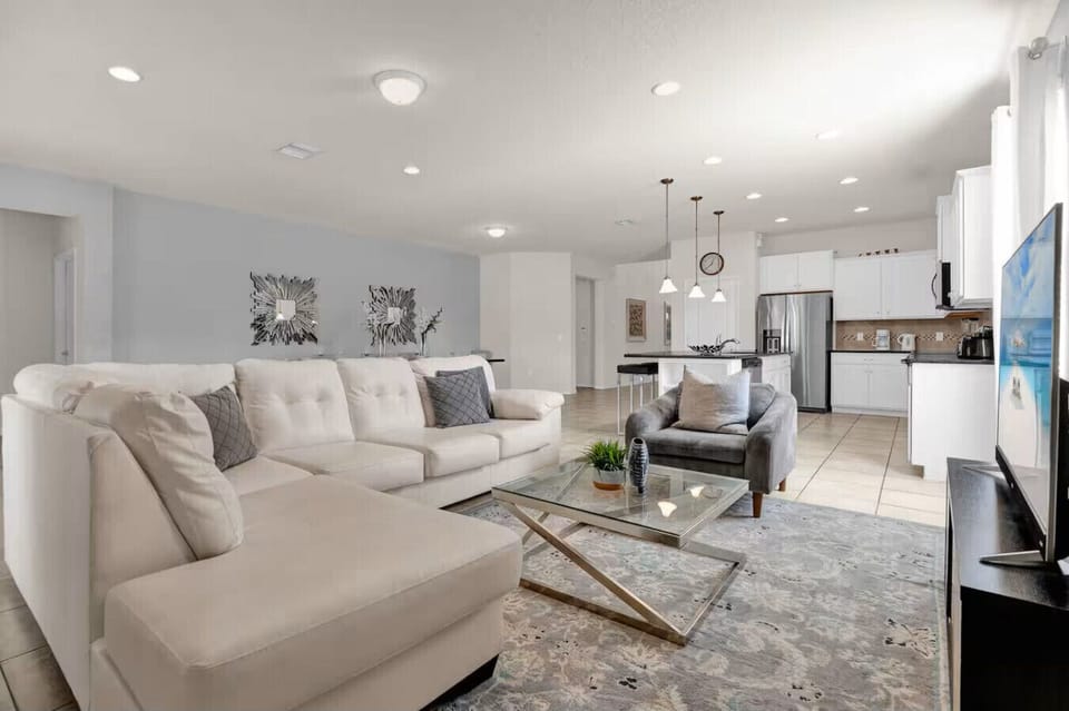 Relax and unwind in the stylish living area with open kitchen access.