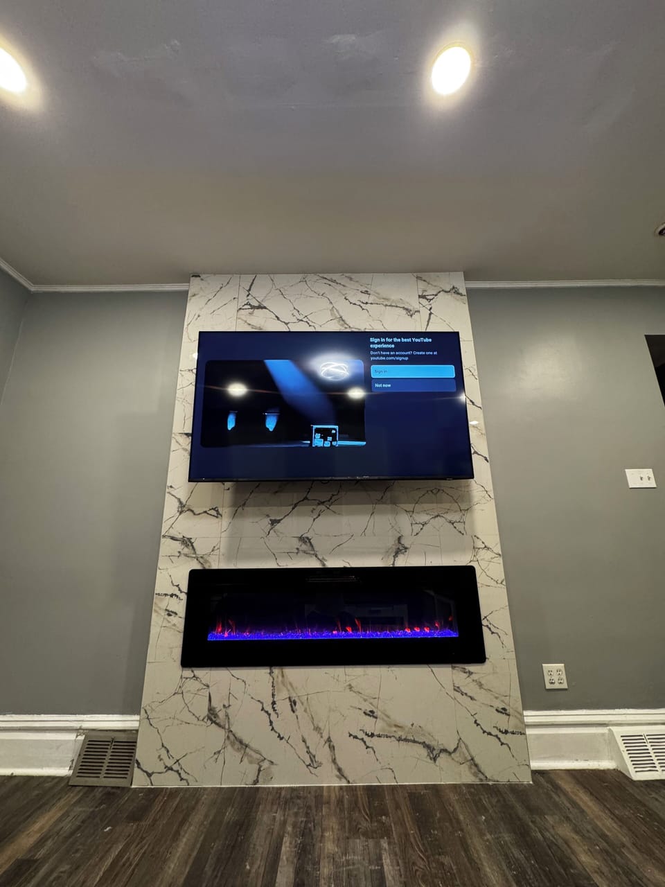 Marble fireplace with 65 inch UHD smart TV