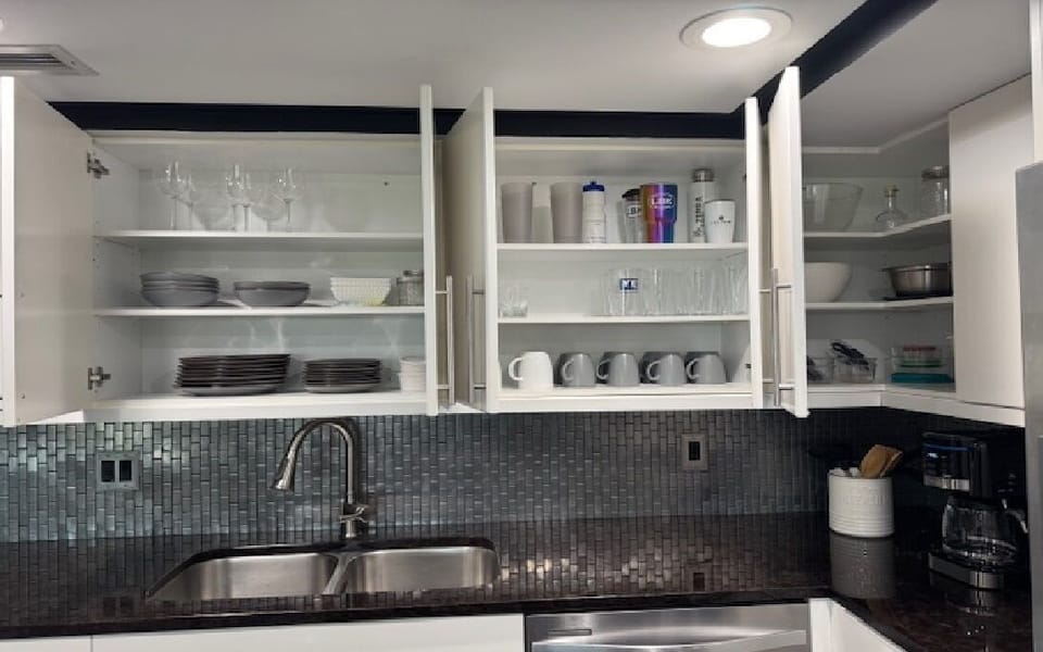 Well stocked kitchen, dinnerware and  new cusinart coffee maker.