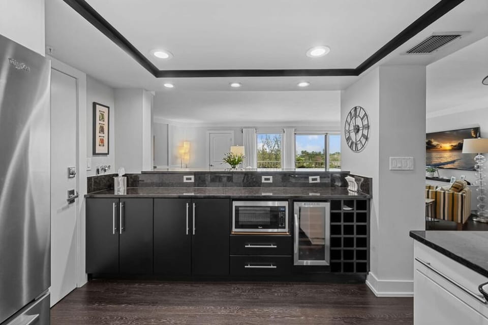 Kitchen with microwave and wine cooler