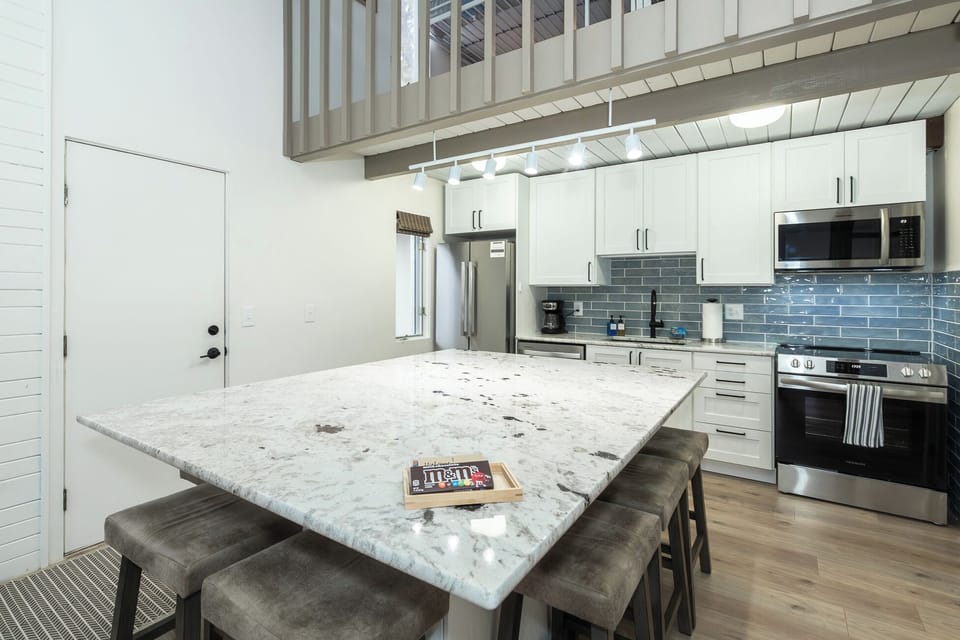 Large island seats 8 and is the perfect spot for sharing meals or playing games