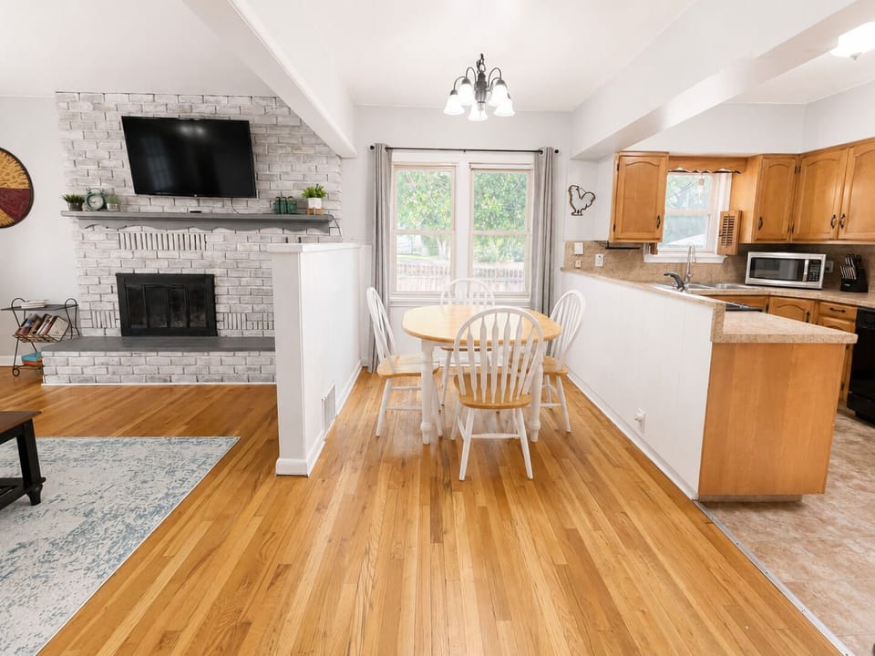 Open living, dining & full kitchen with Smart TV and fireplace