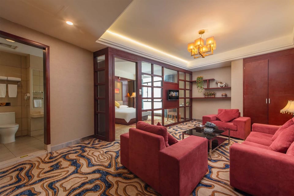 Luxury Suite, City View | Minibar, desk, laptop workspace, blackout drapes